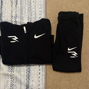 Nike Kids Black zip up sweater and sweat pants with White Logos